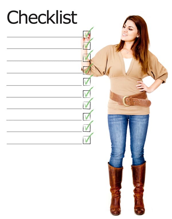 Woman ticking on a checklist - isolated over a white background